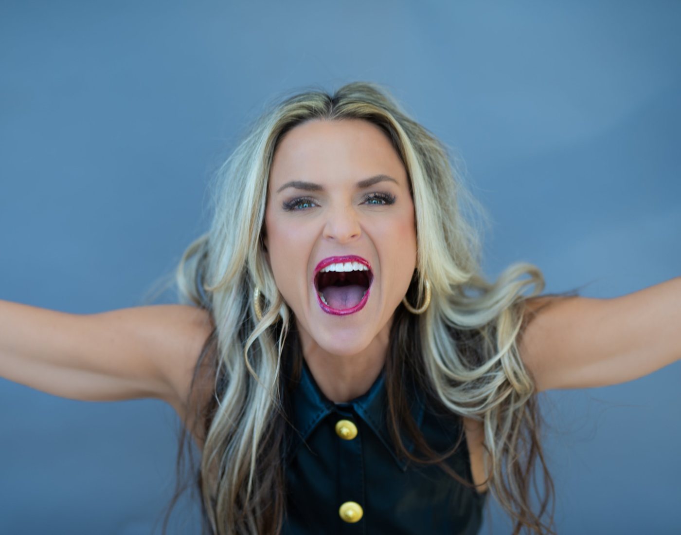 Erika Rothenberger cheering with her arms wide open