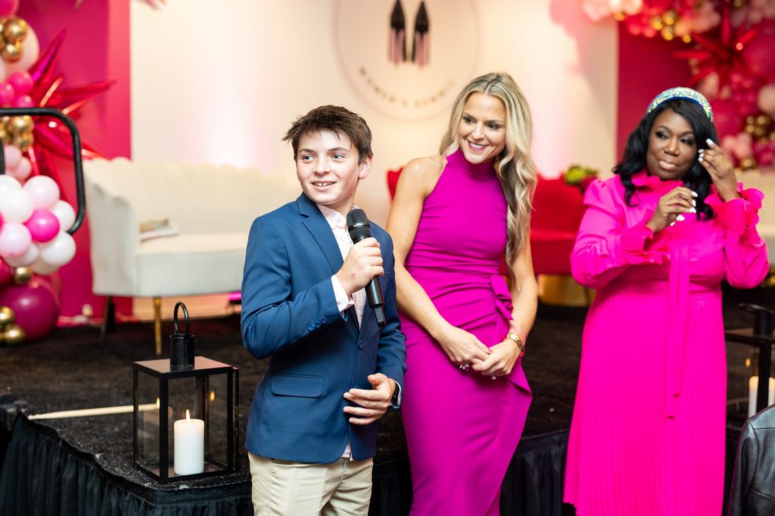 Erika Rothenberger's son speaking on stage beside her