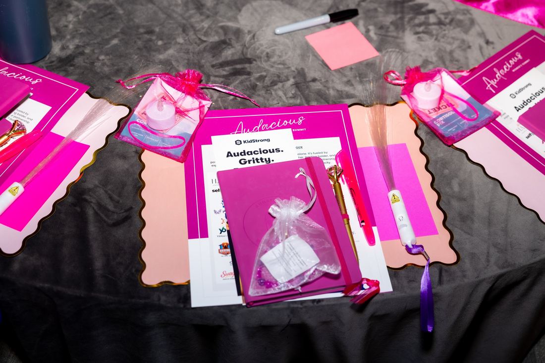 A Summit table setting with notebook and gifts